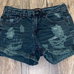 Black ripped shorts.